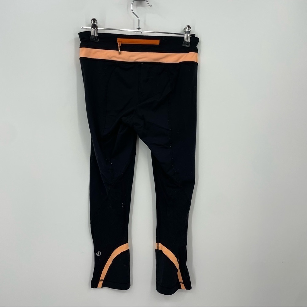 Lululemon Run: Inspire Crop II in Black/Orange Pop leggings Sz 4